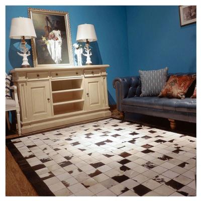 China Washable Black And White Patchwork Cowhide Rug Rug Pattern Geometric Cowhide Blanket for sale