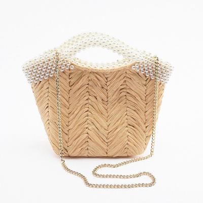 China Others Shape Beads To Handle Rattan Women Handbags Chains Luxury Wicker Woven Shoulder Cross - Body Bags Lady Summer Beach Bali Straw Bag for sale