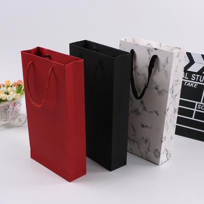 China Recyclable Kraft Paper Bags Jewelry Gift Bags With Ribbon Handle for sale