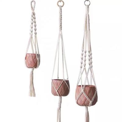 China Outdoor Environmentally Friendly Durable Cotton Rope Plant Pot Hanging Basket With Decorative Beads for sale