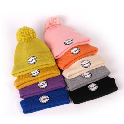 China COMMON Winter Warm Unisex White Multi Color Acrylic Knitted Beanie Hats With Pom Pom for sale