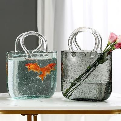 China Creative Nordic bag flower arrangement water basket living room decoration primary color minimalist carrying glass vase for sale