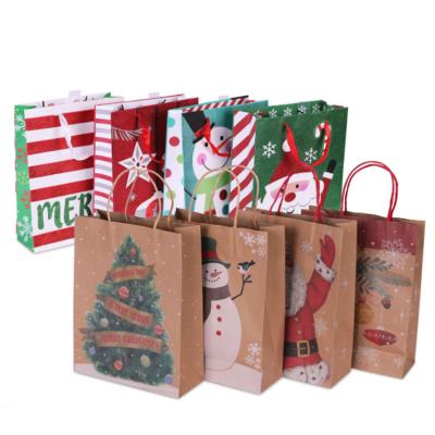 China Biodegradable Custom Paper Handle Holiday Birthday Christmas Kids Gift Packaging Bag for sale