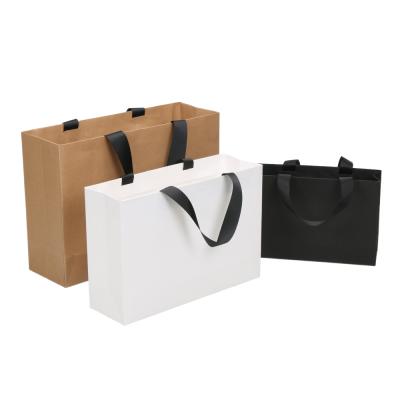 China Handmade Biodegradable White Kraft Paper Shopping Bag Christmas Holiday Decorations Gift Paper Bags for sale