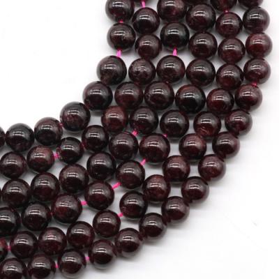 China Pleochroic/Pleochroism Natural Plain 10mm Around Smooth Chinese Garnet for sale