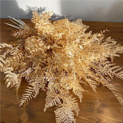 China Durable Artificial Flowers Decoration Gold Color Gold Plastic Leaves Centerpieces For Wedding Table for sale