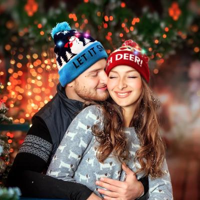 China OurWarm Christmas Decoration 2020 Cheap Blue Red Christmas Beanie Cap Santa LED Merry Christmas Plush Adults Baby Kids Winter Hats With Light for sale