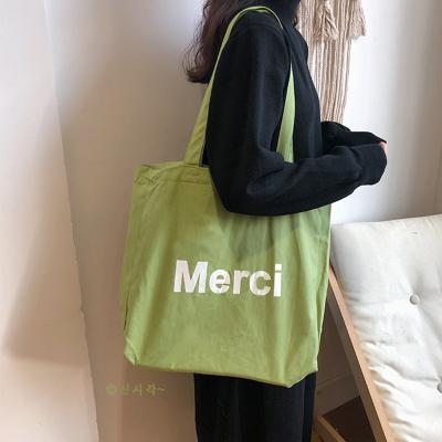 China Eco-Friendly Promotional Color Printed To Recycle Lady Beach Cotton Shopping Simple Letter Organic Fabric Casual Cool Folding Canvas Tote Bag for sale