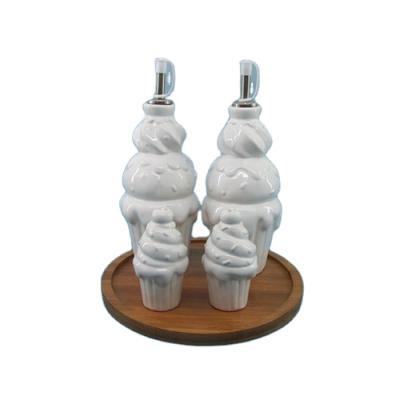 China Sustainable Wholesale White Ceramic Oil Vinegar Salt Pepper Shaker Set With Ice Cream Shape for sale