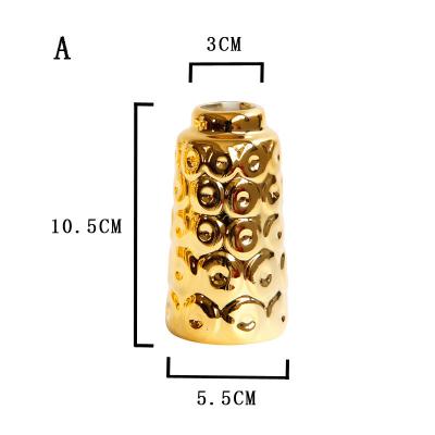 China Europe Gold Hollow Circular Ceramic Flower Vase Decor Gold Vases Centerpiece Small Mouth Vases Gold Nordic Decorative Tabletop Decor for sale