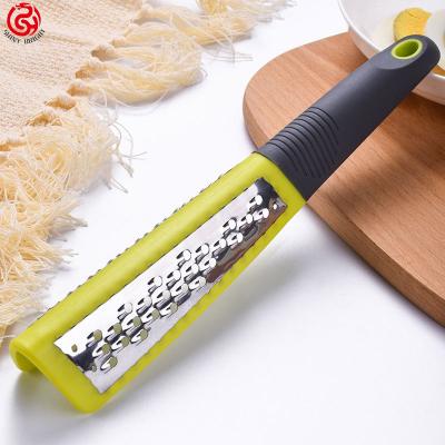 China Hot Selling Viable Amazon Kitchen Stainless Steel Lemon Zester Cheese Grater With TPR Handle for sale