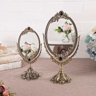 China Alloy Retro Carved metal Gold Makeup Mirror Creative European Classical double-sided Bedroom Dressing Mirror for sale