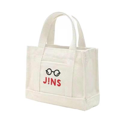 China Custom White Handled Cotton Canvas Bag Supplier With Logos Boutique Cotton Beach Canvas Shopping Bag Fashion Women Blank Tote Bag for sale