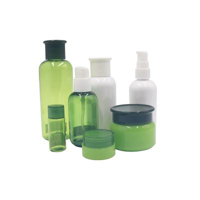 China High Quality Olive Green Cosmetic Essential Oil Lotion Pump PET Bottles Plastic Cosmetic Line Packing PP Jars Set for sale