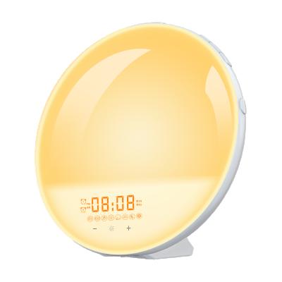 China Modern Multifunctional Wake Up Light Alarm Clock Led Colorful Color Atmosphere Bedside Table Lamp Radio Changing Creative Alarm Clock for sale