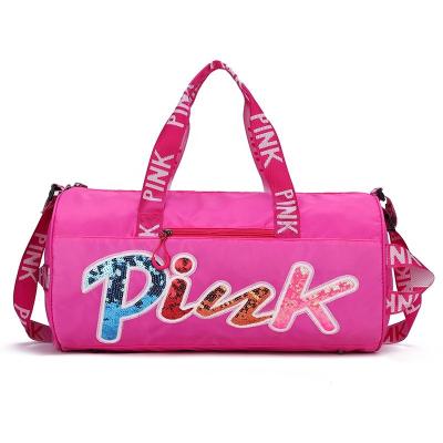 China Custom Logo Duffel Bag For Women Travel Duffel Bag Lady Pink Sequin Letter Waterproof Luxury Duffle Gym Bag 2022 for sale