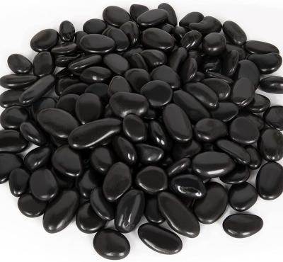 China Modern Natual Black Pebble Stone For AIKING Decoration for sale