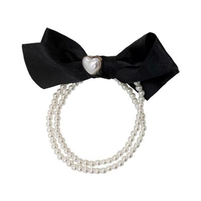 China Fashion Small Retro French Temperament Perfume Pearl Hair Ring Bow Hair Ornament Soft Link Rope for sale