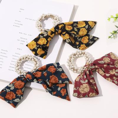 China Fashion Pearl Elastic Hair Band Flowers Printed Cloth Hair Tie Flame Ribbon Hair Scrunchies For Ladies for sale