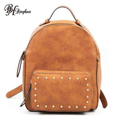 China Fashion rivet waterproof vintage leather backpacks for girls high quality school backpacks for students for sale