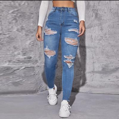 China 2022 Women's Breathable Denim Fringe Light Wash Breathable Sexy Ripped Jeans Destroyed Solid Color Slit Jeans for sale