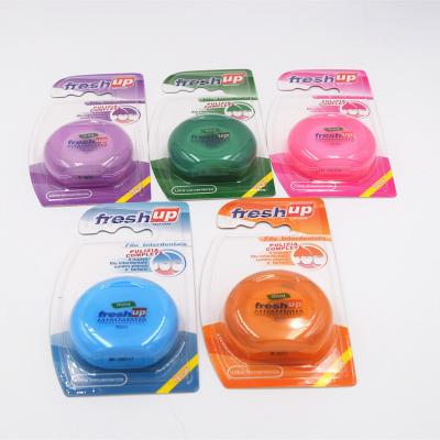 China PTFE Blister Card Pack Round Shape Dental Flosser Dispenser Mint Flavor Waxed Floss. for sale