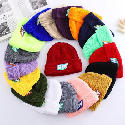 China COMMON Wholesale Winter Mens Womens Warm Custom Acrylic Beanie Hat With Rubber Patch Logo for sale