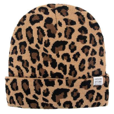 China Hot hengxing COMMON sports logo beanies hat leopard unisex skull caps with custom logo for sale