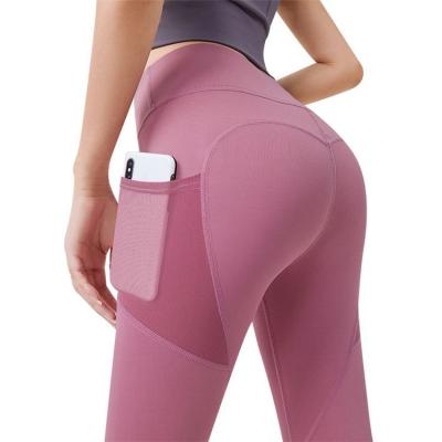 China Breathable Women Stretch High Waist Yoga Pants With Mesh Pockets Workout Running Sport Yoga Gaiters for sale