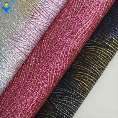 China Embossed design attractive PU embossed mirror glitter leather fabric for sale