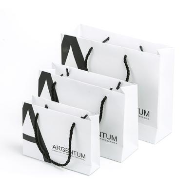 China Wholesale Eco-friendly Luxury White Recycled Materials Paper Bag Matte Kraft Paper Bag With Cotton Rope Handles for sale