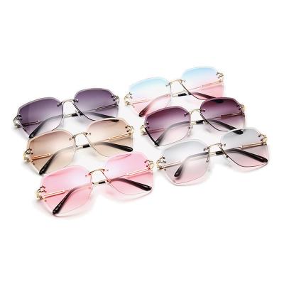 China 2022 Hot Sale Sunglasses Rimless Luxury Sun Lenses Vintage Rimless Sunglasses Women Diamond Glass Fashionable Colorful Custom Logo for sale