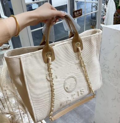 China 2021 New High Quality Small Square Border Printing Fashion One-shoulder Messenger Bag Pearl Canvas Large Capacity Bag for sale