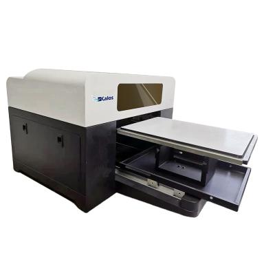 China Kalos Hot Sale A3 Size Two Heads CMYK White Desktop Direct T-shirt Printing Machine For Garment Custom Kalos A3 PLUS for sale