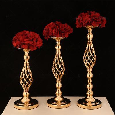 China Creative Metal Iron Wrought Iron Candlestick Hollow Flower Stand Ornaments Wedding Props for sale