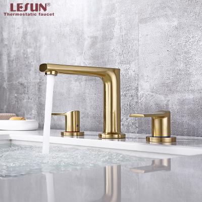 China LESUN China Bathroom Supplies 3 Hole 2 Handle Water Tap Gold Tap Modern Basin Faucet Cold And Hot Mixer Taps for sale