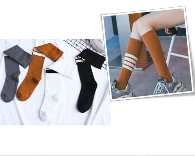 China Breathable GG women's long knee high sock cc words stocking cotton young women's combed tube socks for sale