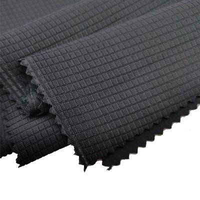 China Breathable Hot Sale Knitted High Stretch Fabric Plaid Jacquard Sportswear Fabric for sale