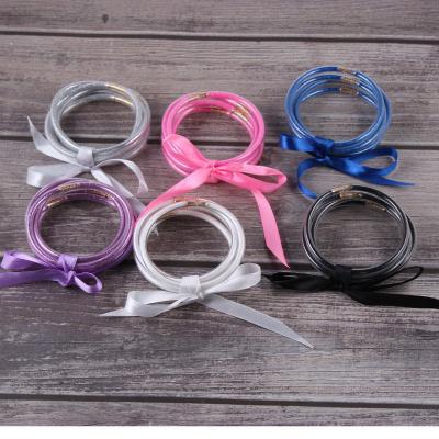 China TRENDY Silica Gel Glitter Filled Silver Jelly Bangles For Women Gifts Colorful Gold Glitter Handmade Jewelry Bowknot Bracelets 5pcs/set for sale