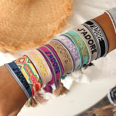 China Fashion Ethnic Handcrafted Jewelry Boho Custom Rainbow Braided Nepal String Cotton Woven Macrame Knotted Female Bracelet With Tassel for sale