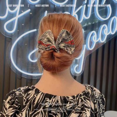 China 2021 European and American style fashion new style for skillful bun iron wire metal twisting bow hairpin for sale