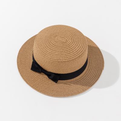 China 2022Custom Sunscreen Simple Elegant Straw Hat Bowknot Sun Protection Straw Hat Flat Wide Brim Beach Comfortable Soft Women Retro Hat for sale