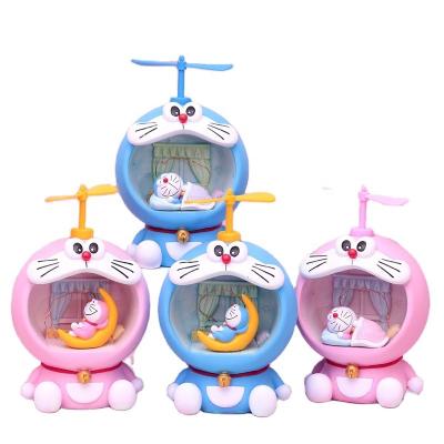 China Europe & Southeast Asian & Northeast Asia & America's Creative Cartoon Blue Flying Cat Piggy Bank with LED Rice Grain Light for sale