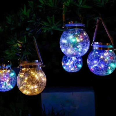 China Cheap Custom Hot Sale Fine Appearance Round Lighting Crackled Glass Solar Garden Lanterns Hanging Decorative Lamp for sale