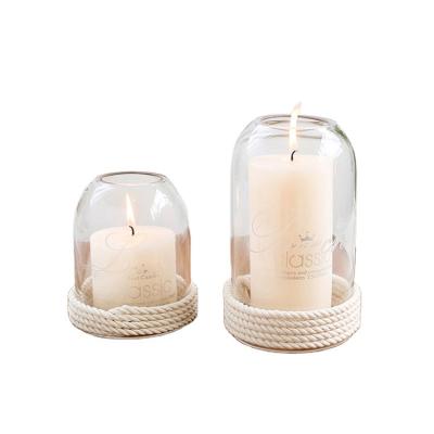 China Religious Activities Enjoy Fast Selling Borosilicate Glass Candle Holders Tops With Straw Rope At The Bottom for sale