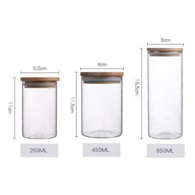 China Eco-freindly high factory direct multi size borosilicate glass storage jar with wooden/bamboo lid for sale