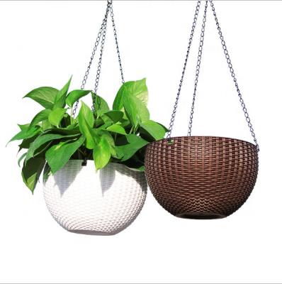 China Self Watering Pot China Round Decor Resin Rattan Round Plastic Hanging Basket Planter Flower Plant Pot With Drip Tray for sale