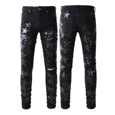 China Waterproof OEM black Star Patches Relaxed Jeans Bright Soft Regular Plus Size Appliqued Men's Jeans Tapered for sale