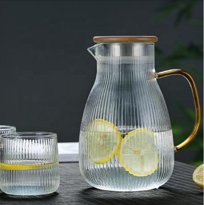 China Viable Clear Borosilicate Glass Water Pitcher / Carafe / Jug With Stainless Steel Bamboo Filter And Clasp for sale