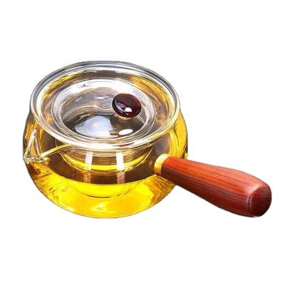 China New Design Sustainable Heat Resistant Glass Teapot Glass Tea Cooking Pot With Wooden Handle for sale